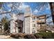 A stylish building boasts eye-catching architectural details and manicured lawns at 17505 E Mansfield Ave # 1411L, Aurora, CO 80013