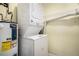 Laundry room featuring a stacked washer and dryer at 17505 E Mansfield Ave # 1411L, Aurora, CO 80013