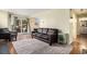 Welcoming living room featuring wood floors, sliding door, and an open layout at 17505 E Mansfield Ave # 1411L, Aurora, CO 80013