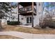Exterior view of ground level patio with easy access, covered deck above, and landscape at 17505 E Mansfield Ave # 1411L, Aurora, CO 80013