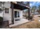 Ground level patio with sliding glass door for easy access and mature landscaping at 17505 E Mansfield Ave # 1411L, Aurora, CO 80013