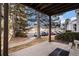 View from shaded patio looking out to the parking lot surrounded by mature landscaping at 17505 E Mansfield Ave # 1411L, Aurora, CO 80013