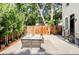 Peaceful backyard patio with seating area and wooden fence at 3044 W 29Th Ave, Denver, CO 80211