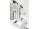 Spa-like bathroom with double vanity, large mirrors, and modern fixtures at 3044 W 29Th Ave, Denver, CO 80211