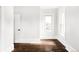 Simple bedroom with hardwood floors and two large windows at 3044 W 29Th Ave, Denver, CO 80211