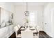 Elegant dining room with hardwood floors and a large window at 3044 W 29Th Ave, Denver, CO 80211