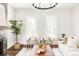 Living room with hardwood floors, fireplace, and large windows at 3044 W 29Th Ave, Denver, CO 80211