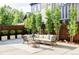 Relaxing patio with wicker furniture and concrete flooring at 3044 W 29Th Ave, Denver, CO 80211