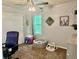 Bright bedroom area with a ceiling fan, a ball pit, and a large window at 1286 Finch Ave, Brighton, CO 80601