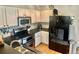 Modern kitchen with stainless steel appliances, updated cabinets, and functional layout, ready for culinary adventures at 1286 Finch Ave, Brighton, CO 80601