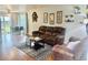 Inviting living room with wood floors, cozy furniture, and natural light, perfect for relaxation and entertaining at 1286 Finch Ave, Brighton, CO 80601