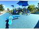 Neighborhood playground with slides, climbing structure, and soft blue rubber ground at 1286 Finch Ave, Brighton, CO 80601