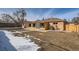 Backyard featuring brick home, wood siding, with lawn and a stone pathway at 1330 E 90Th Ave, Thornton, CO 80229