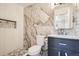 Bathroom featuring unique tile design on floors and walls with modern fixtures at 1330 E 90Th Ave, Thornton, CO 80229