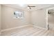 Bright bedroom with wood-look floors, a ceiling fan, and a large window at 1330 E 90Th Ave, Thornton, CO 80229