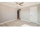 Bedroom with wood-look floors, crown molding and a ceiling fan at 1330 E 90Th Ave, Thornton, CO 80229