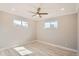 Bright, neutral bedroom with wood-look floors, two windows and ceiling fan at 1330 E 90Th Ave, Thornton, CO 80229