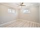 Neutral bedroom with wood-look floors, two windows and ceiling fan at 1330 E 90Th Ave, Thornton, CO 80229