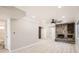 Open-concept living space with modern floors, a stone fireplace and neutral paint at 1330 E 90Th Ave, Thornton, CO 80229