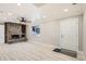 Bright and spacious living area showcasing a stone fireplace and modern flooring at 1330 E 90Th Ave, Thornton, CO 80229