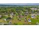 Aerial view of a residential property surrounded by green lawns, trees, and a nearby road at 8840 Niwot Rd, Niwot, CO 80503