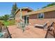 Relaxing back deck offers an outdoor dining area and lounge seating, perfect for enjoying sunny afternoons at 8840 Niwot Rd, Niwot, CO 80503