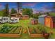 Beautiful backyard includes RV parking, a chicken coop, garden beds, and a charming shed, perfect for outdoor hobbies at 8840 Niwot Rd, Niwot, CO 80503
