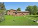 Beautiful backyard with a spacious wooden deck, lush lawn, and mature trees, perfect for outdoor living at 8840 Niwot Rd, Niwot, CO 80503