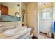 Single sink vanity and a glass enclosed shower inside a bright bathroom at 8840 Niwot Rd, Niwot, CO 80503