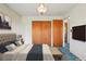 Staged bedroom features a closet and two doors, and a light and neutral palette at 8840 Niwot Rd, Niwot, CO 80503