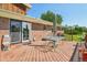 Spacious wooden deck with outdoor seating and sliding glass door access at 8840 Niwot Rd, Niwot, CO 80503