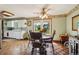 Traditional dining area with a round table, floral wallpaper, and access to the kitchen at 8840 Niwot Rd, Niwot, CO 80503