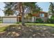 Charming two-story brick home with a two-car garage and a well-maintained front yard at 8840 Niwot Rd, Niwot, CO 80503