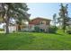 Charming two-story brick home featuring a well-maintained lawn and a classic front porch at 8840 Niwot Rd, Niwot, CO 80503