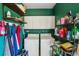 Practical laundry room with shelving, storage, and a washer and dryer at 8840 Niwot Rd, Niwot, CO 80503