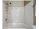 Full bathroom featuring a tub and shower combination with tile surround at 12925 Grant Cir # A, Thornton, CO 80241