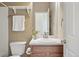 Bathroom featuring a single vanity, mirror, toilet, and a shower/tub combo at 12925 Grant Cir # A, Thornton, CO 80241