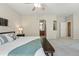 Expansive primary bedroom offers a glimpse into the ensuite bathroom at 12925 Grant Cir # A, Thornton, CO 80241