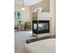 Large bedroom features a fireplace separating sleeping and lounging spaces at 12925 Grant Cir # A, Thornton, CO 80241