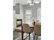 Dining room with neutral walls, fireplace, modern lighting and lots of natural light at 12925 Grant Cir # A, Thornton, CO 80241