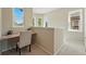 Bright upstairs hallway area with a cozy workspace nook at 12925 Grant Cir # A, Thornton, CO 80241