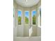 Upstairs landing with a trio of windows providing natural light at 12925 Grant Cir # A, Thornton, CO 80241