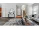 Inviting living room with hardwood floors, neutral walls, staircase and lots of natural light at 12925 Grant Cir # A, Thornton, CO 80241