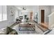 Spacious living room featuring modern furnishings, fireplace, and open floorplan at 12925 Grant Cir # A, Thornton, CO 80241