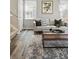 Cozy living room featuring stylish decor, rug, and modern finishes at 12925 Grant Cir # A, Thornton, CO 80241