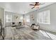 Bright living room featuring modern furnishings, ceiling fan, and hardwood flooring at 12925 Grant Cir # A, Thornton, CO 80241