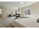 Spacious main bedroom suite offers a cozy fireplace, ceiling fan, and lots of natural light at 12925 Grant Cir # A, Thornton, CO 80241