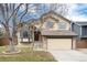 Charming two-story home with attached two-car garage and neutral paint at 1296 Ascot Ave, Highlands Ranch, CO 80126