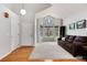 Bright and airy living room featuring high ceilings, large windows, and hardwood floors at 1296 Ascot Ave, Highlands Ranch, CO 80126