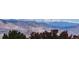Distant mountain range with snow-capped peaks as seen from the property at 1296 Ascot Ave, Highlands Ranch, CO 80126